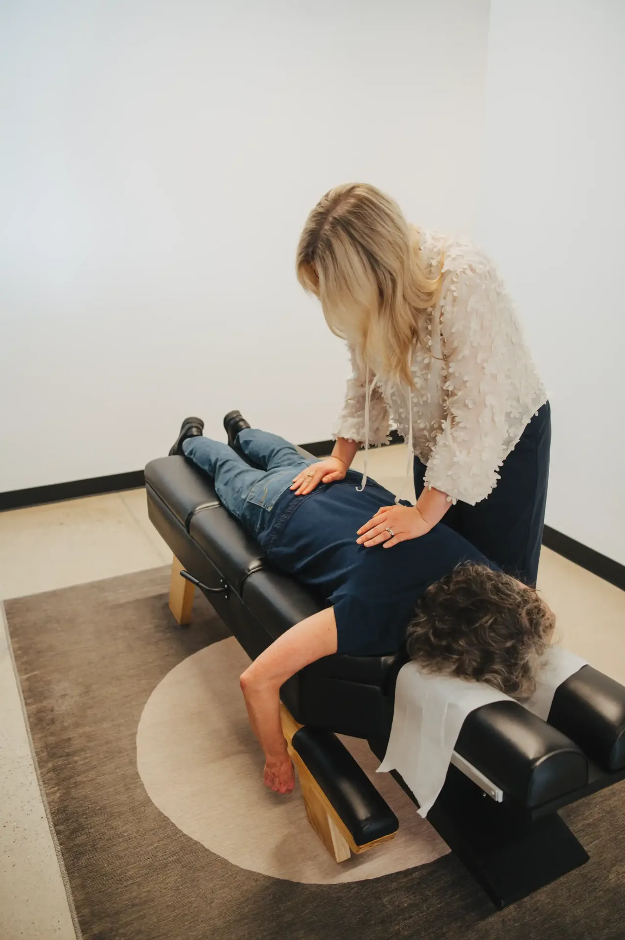 Dr. Mariah adjusting the lumbar spine of a practice member